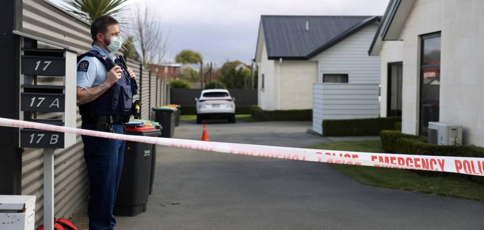 Police stand guard at the scene of the Timaru triple homicide. Photo: George Heard