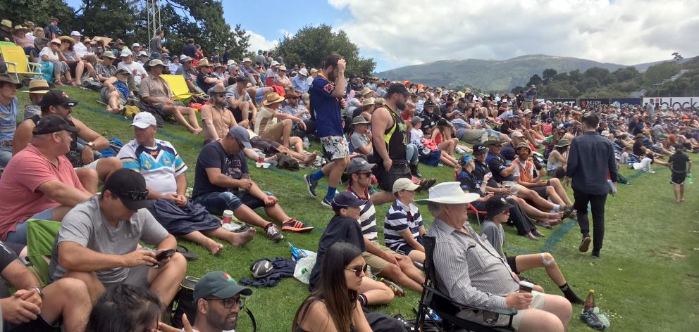 Cricket spectators watching the NZ-Bangladesh ODI line the banks of the University of Otago Oval today. Photo: Peter McIntosh Cricket spectators watching the NZ-Bangladesh ODI line the banks of the University of Otago Oval today. Photo: Peter McIntosh