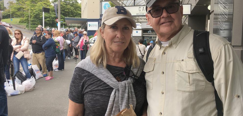 Diamond Princess passengers Dave and Peg Kimball, of Arizona, wait for a bus in Moray Pl yesterday. Photo: Shawn McAvinue Diamond Princess passengers Dave and Peg Kimball, of Arizona, wait for a bus in Moray Pl yesterday. Photo: Shawn McAvinue