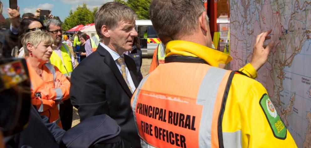 Prime Minister Bill English briefed on the progress if the firefighters against the Port Hills fire in Christchurch. Photo: Christchurch District Council  