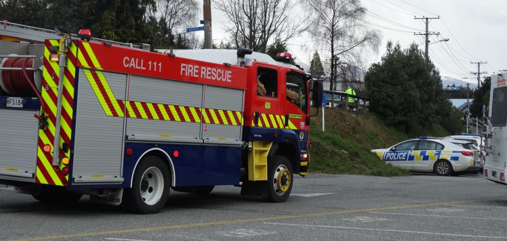 Fire crews and police were called to the intersection of Weaver St and Gorge Rd in Queenstown today after a paraglider crashed into a power line. Photo: Joshua Walton