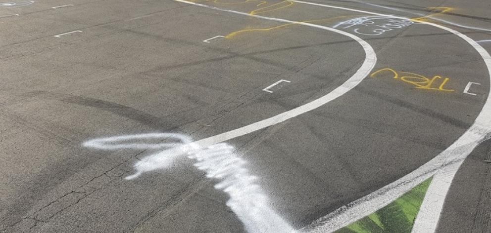 Spray-painted graffiti on the track at the Otago Radio Control Car Club. Photo: Jamie Scott via Facebook Spray-painted graffiti on the track at the Otago Radio Control Car Club. Photo: Jamie Scott via Facebook