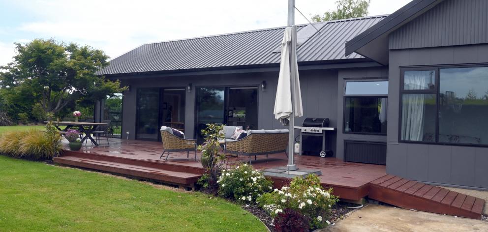 Large windows and doors give good indoor-outdoor flow to the deck and garden. PHOTO: CRAIG BAXTER