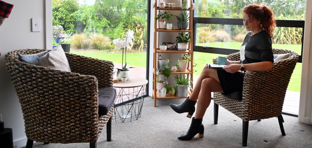 Indoor plants feature throughout the home, including in the sitting area at the end of the main...