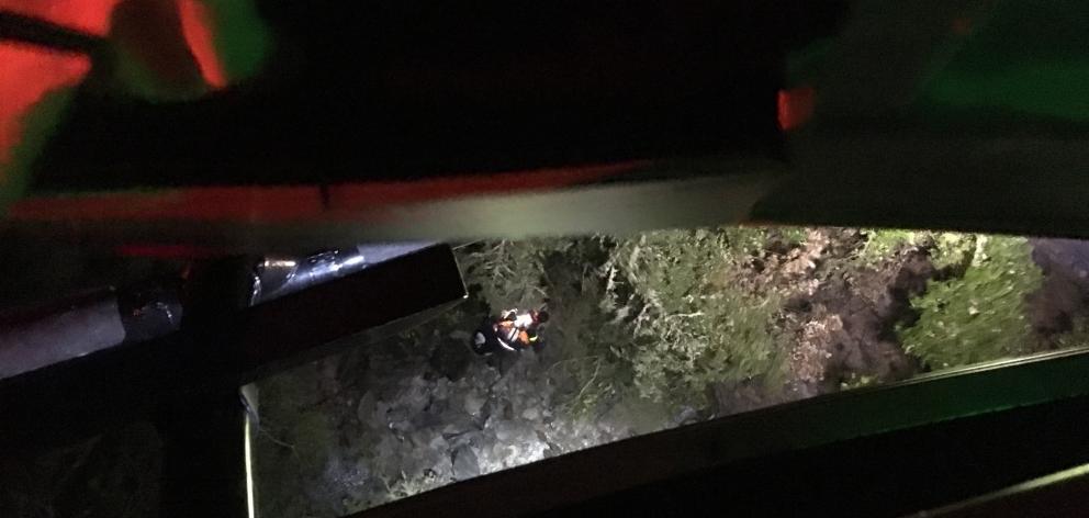 The group were found deep down a gully in next to a stream under tall dense bush in a pitch black environment. Photo: Otago Rescue Helicopter Trust The group were found deep down a gully in next to a stream under tall dense bush in a pitch black environment. Photo: Otago Rescue Helicopter Trust