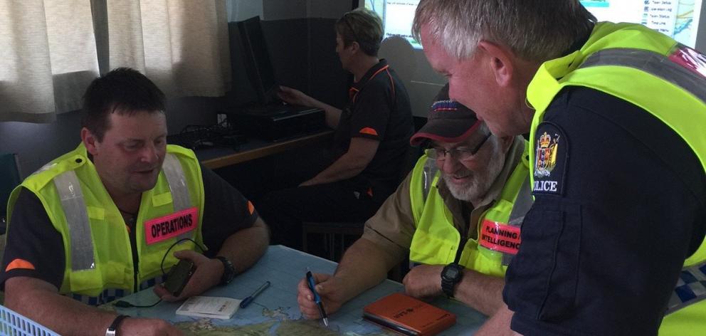 Land Search and Rescue volunteers (from left) Adrian Dance and Graeme Irvine with Senior...