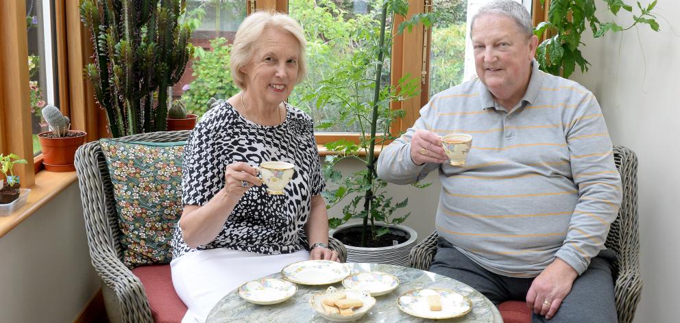 Janet and Martin Ferguson drink tea from his mother's china in the conservatory.