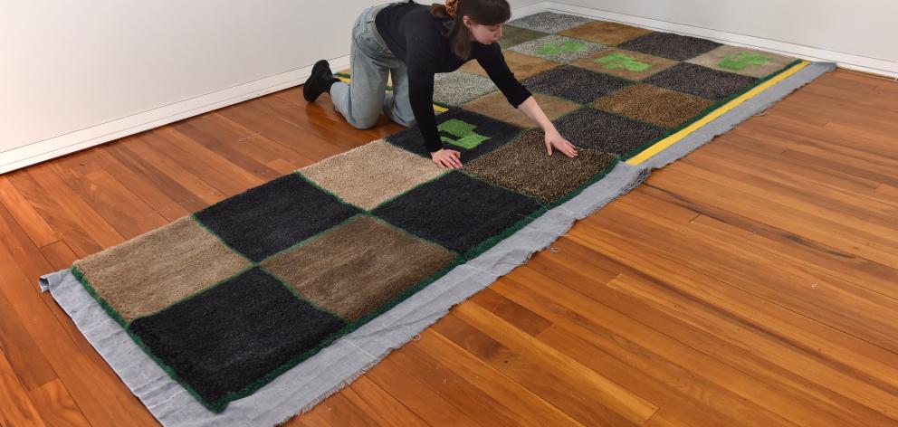 Megan Brady makes carpet in her Stuart St studio. 