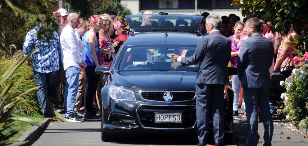 Family members and friends carry the body of Dunedin teenager Amber-Rose Rush to a hearse after...