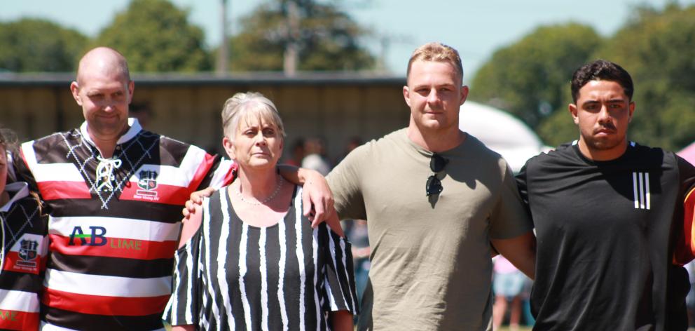 Blair Vining lines up for the national anthem with his mother Pauline and All Blacks players ...