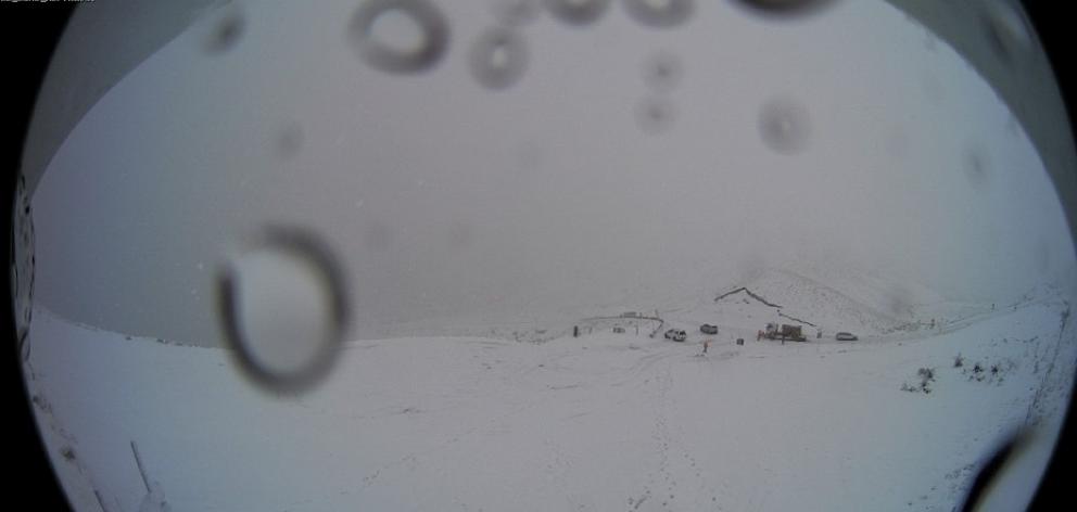 A webcam shows heavy snow on the Crown Range Road this afternoon. Photo: MetService