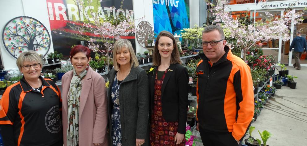 Cancer Society Otago-Southland representatives meet  Mitre 10 Mega representatives to mark the...