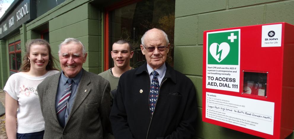 Admiring the new 24/7 access defibrillator at Logan Park High School are (from left) head girl...