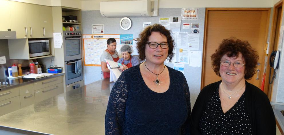 Otago Community Hospice co-ordinator of volunteers Rebecca Shaw (left) visits the hospice kitchen...