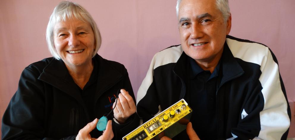 Dunedin LandSAR WandaTrak liaison and administrator Kay Raw holds a radio frequency emitting...