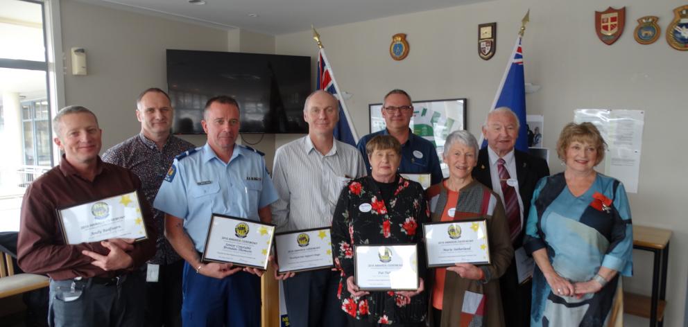 From left: Award recipients Andy Redfearn, Martin Schievink, Senior Constable Brendan Thomson,...