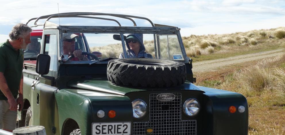 Otago Land Rover enthusiasts' club president Noel harper advises Gerald Harrex and Suzanne Bell