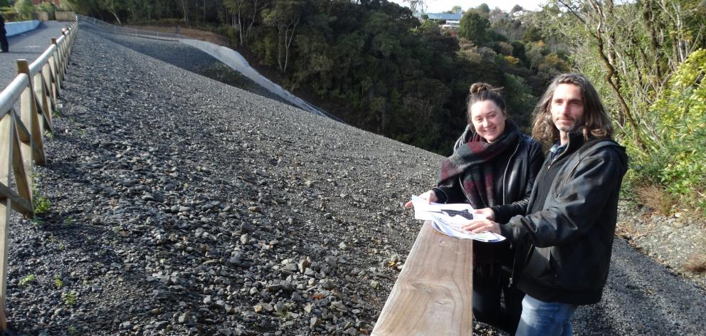 Dunedin artists Katrina Thompson and Ross Sinclair look over the Ross Creek Reservoir dam face,...