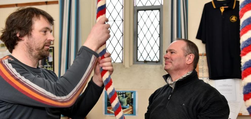 Phil Newman (right), of Twizel, learns the ropes of bell ringing from Nick Phillips. Photo by Gregor Richardson.