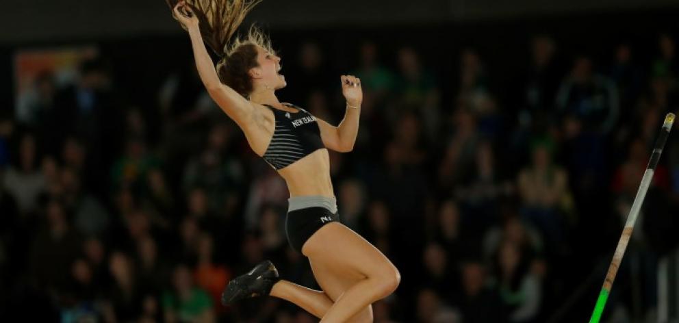 Eliza McCartney clears the bar at the world indoor track and field championships in Portland,...