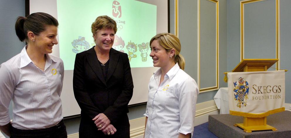 Raylene Bates (centre), the manager of New Zealand athletics Olympic team, with grants recipients...