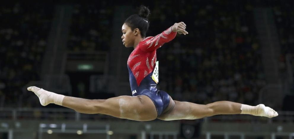 Gabby Douglas of the USA competes on the beam during the women's qualification. Photo: Reuters