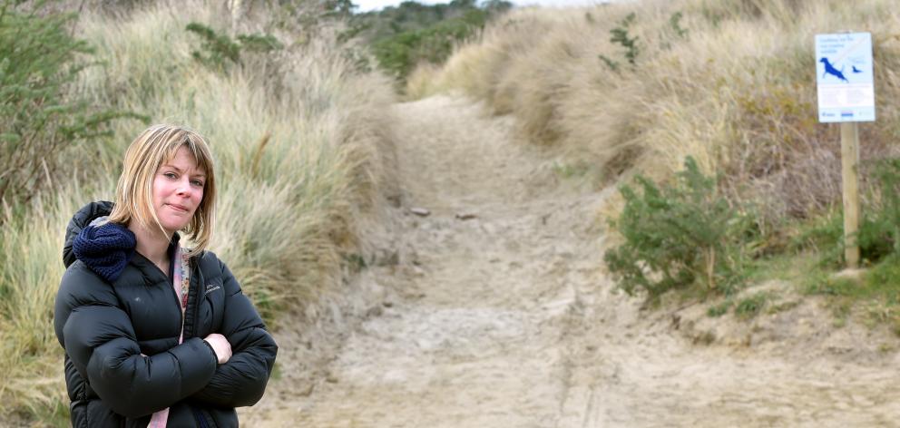 Warrington resident Jackie Hughes stands where a camper van became stuck on a beach-side track on...