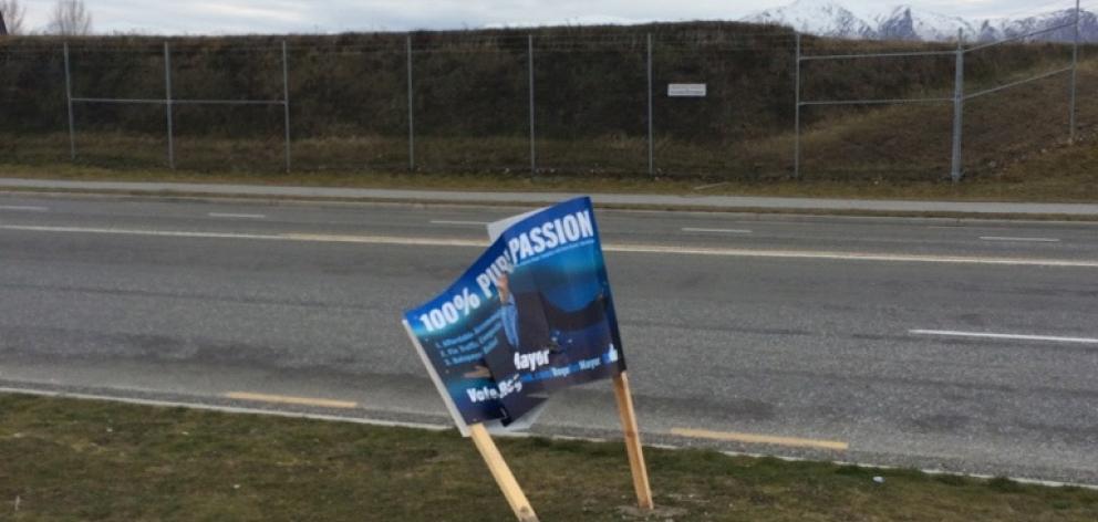 A vandalised election hoarding for Queenstown Lakes mayoral hopeful Roger Tompkins. Photo supplied.