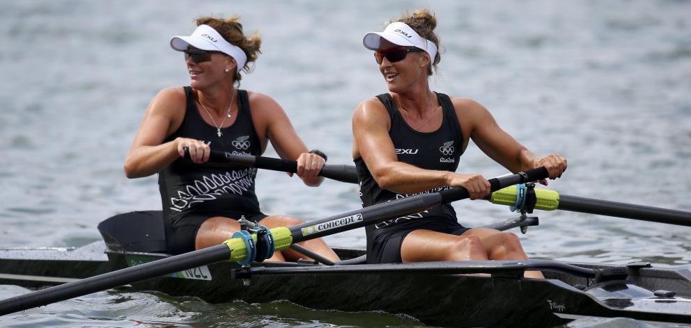 Genevieve Behrent (left) and Rebecca Scown, of New Zealand ,compete in the women's pair heats at...