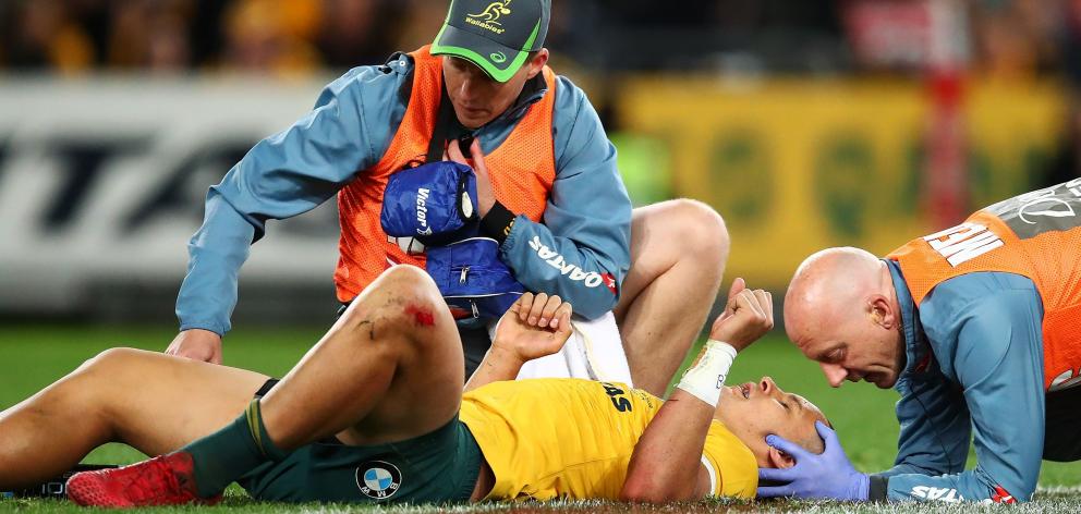 Matt Toomua of the Wallabies receives attention from trainers during the Bledisloe Cup Rugby...