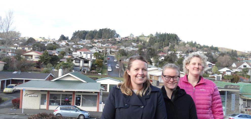 Greater Green Island Community Network workers Amanda Reid (left) and Leanne Stenhouse (right) have been joined by social work intern Meg Beamish for three months as they respond to the results of a wide-ranging community survey. Photo by Brenda Harwood.