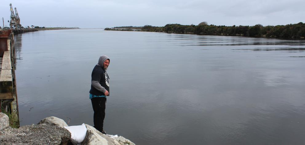 Shane Peipi surveys the Grey River at the coveted whitebaiting  spot, the ‘‘Big Rock’’. Photo:...