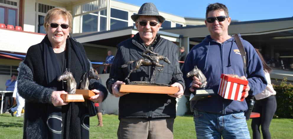 Lorraine, Brian (centre) and Shane Anderton with their swag of trophies won at the Otago Racing...