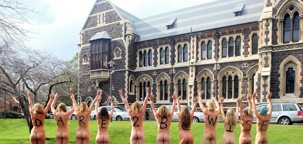 University of Otago Fossil Free Otago group members bare all to show the university how passionate they are about divestment at the university campus on Monday. Photo supplied.