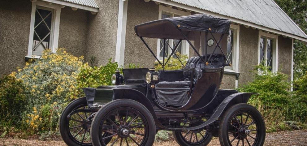 The 112-year-old Baker Electric in the grounds of the Wanaka Anglican Church. Photo: Neville Digby.