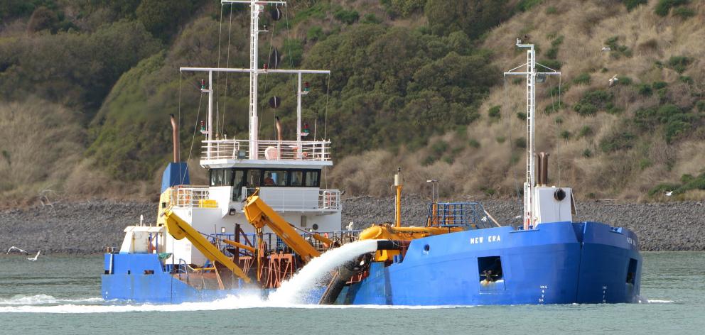  Port Otago’s suction dredge New Era at work near the Otago harbour entrance last week. Photo:...