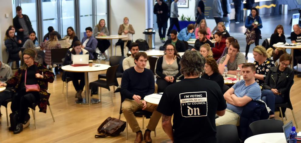 DCC candidate Damian Newell (back to the camera) speaks during an OUSA meet the candidates session at the University of Otago yesterday. Photo by Gregor Richardson.