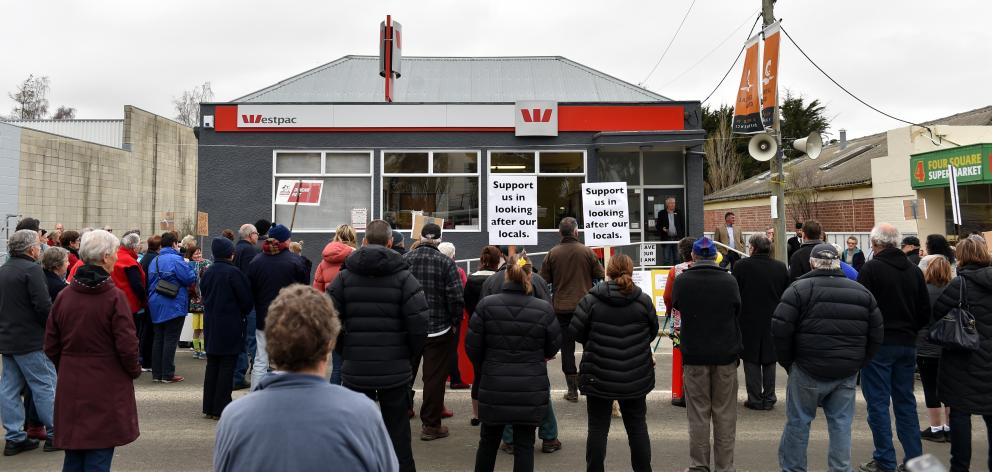 Locals gather outside the Westpac Bank in Ranfurly to protest its closure. PHOTO: PETER MCINTOSH
