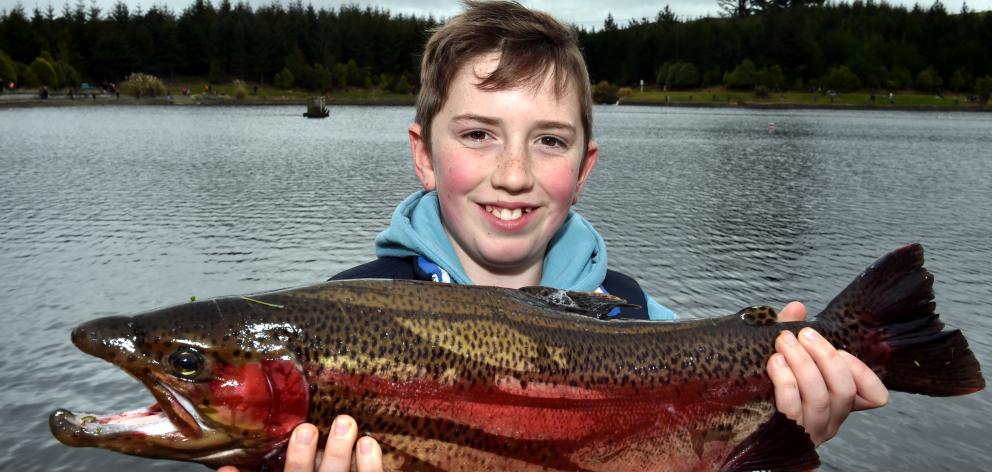 Kyall McKean shows off the 2.9kg rainbow trout he caught at yesterday’s Take a Kid Fishing day at...