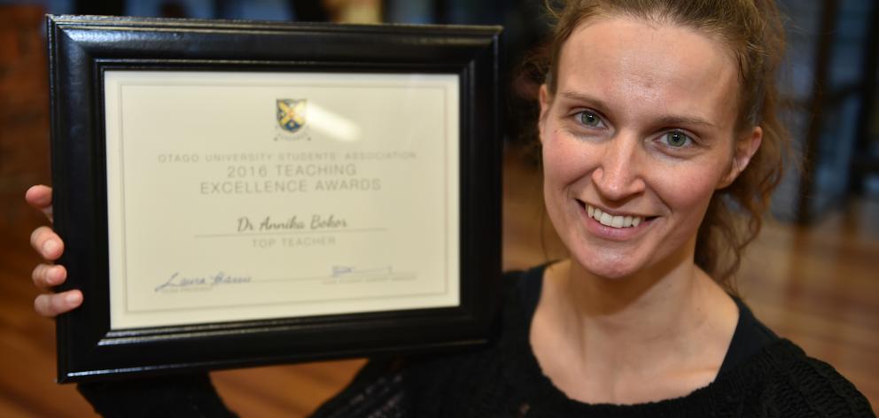 University of Otago lecturer Dr Annika Bokor with her teaching award. Photo by Gregor Richardson.