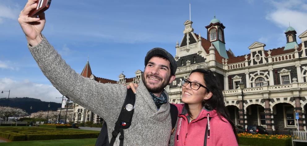 Tourists Eric Valck and Melissa Asselman visit the Dunedin Railway Station as tourism in the...