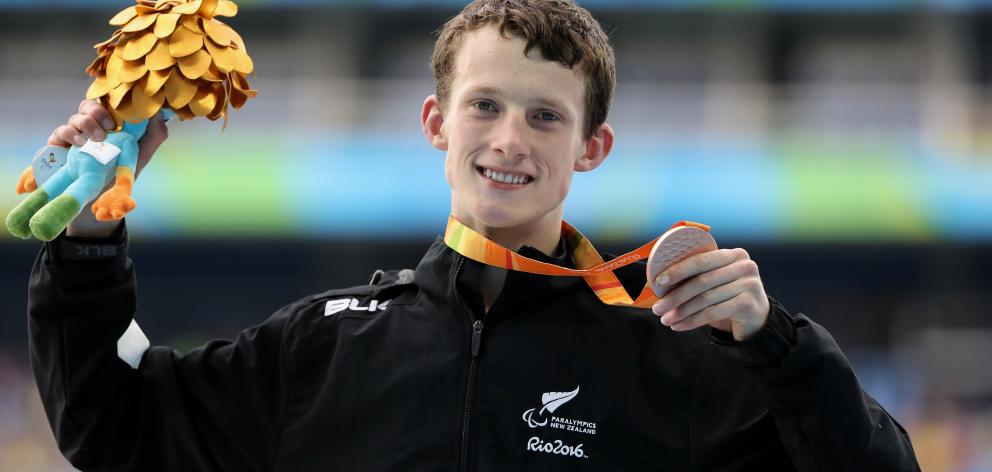 Bronze medalist William Stedman of New Zealand celebrates on the podiuim at the medal ceremony...