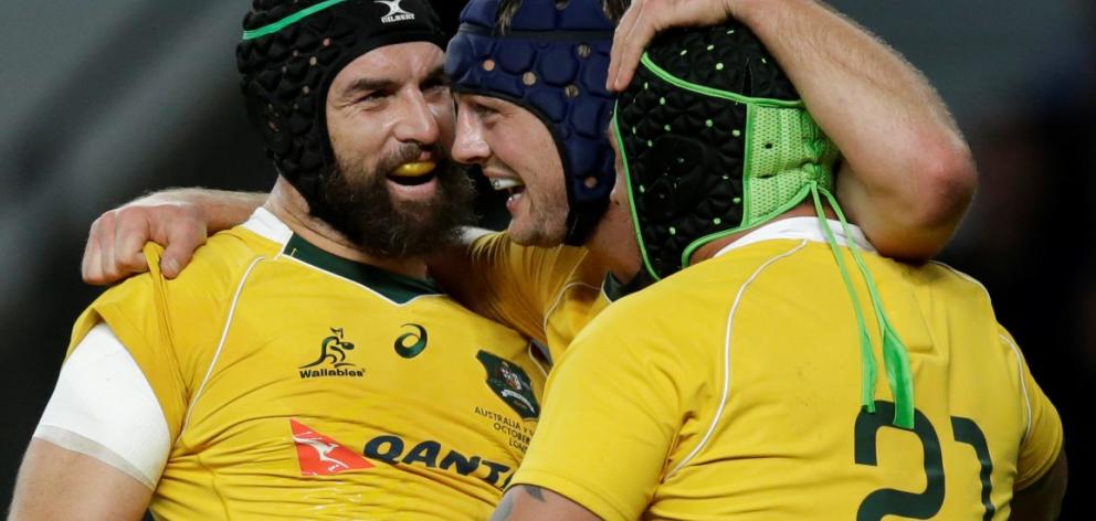 Australia's Dean Mumm (C) celebrates after scoring a try. Photo Reuters