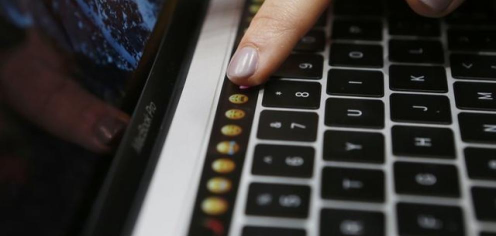 Apple announced new features, like touch keys for it's new MacBook Pro computer. Photo: Reuters