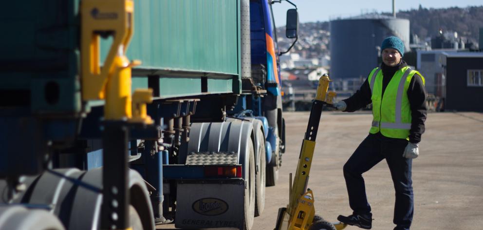 Phil Gruenwaldt demonstrates Bison’s new system for weighing containers on trailer chassis. Photo...