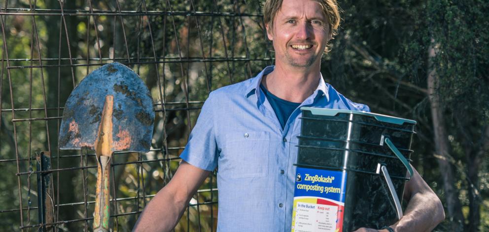 ‘‘Dr Compost’’ Ben Elms is ready to dig a bucketful of bokashi compost into his garden in Hawea...