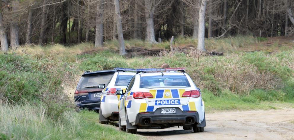 Police cars at the scene at the end of the chase at Waikouaiti. Photo ODT