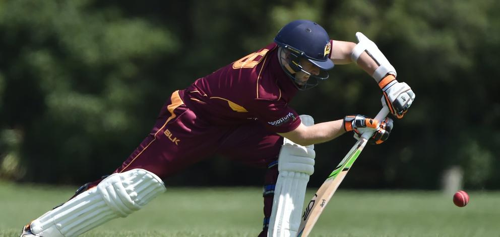 North East Valley batsman Derek de Boorder gets forward during a club match against Kaikorai at...