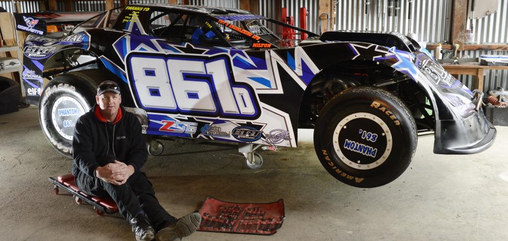 Ricky Boulton, of Milton, and his super saloon vehicle in his farm shed near Milton. Photo:...