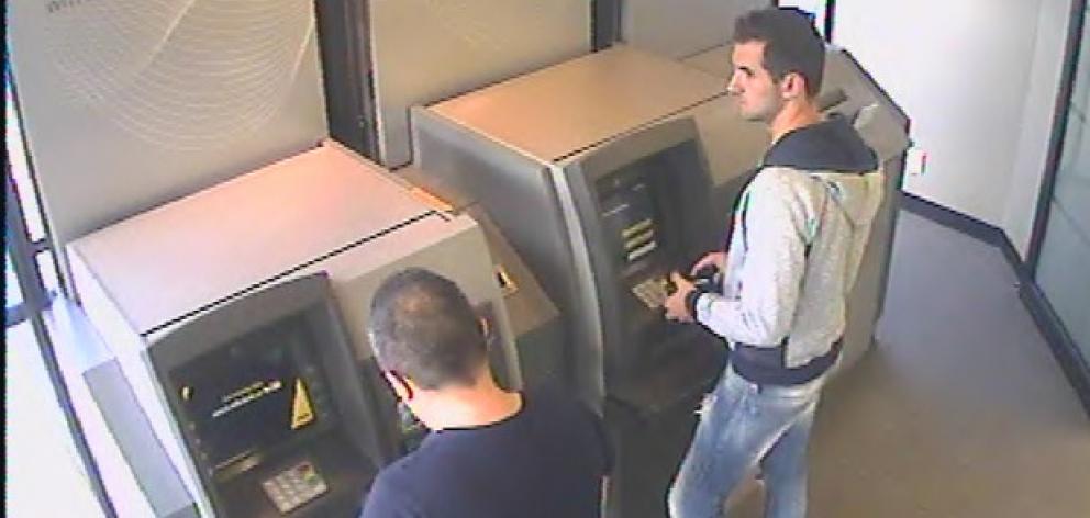 Emanoil Pirjol (left) and Ionut Bilea caught on camera using skimmed cards at an ATM. Photo via...